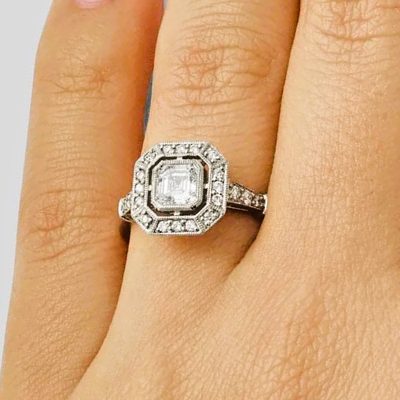 Vintage Design Platinum Asscher Cut Diamond Ring with Round side Diamonds + Halo
