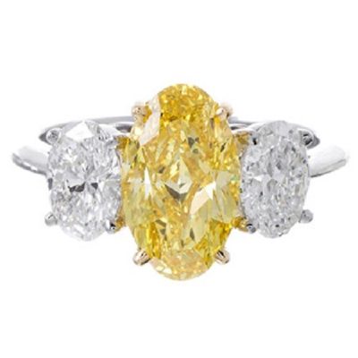 Marvelous Fancy Yellow 2.05 CTW Oval cut Diamond GIA certified 18K White Gold