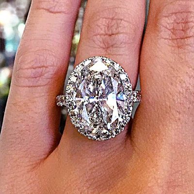 8.00 CT Oval Cut Diamond Center Ring with 18K White Gold Round Side Diamonds